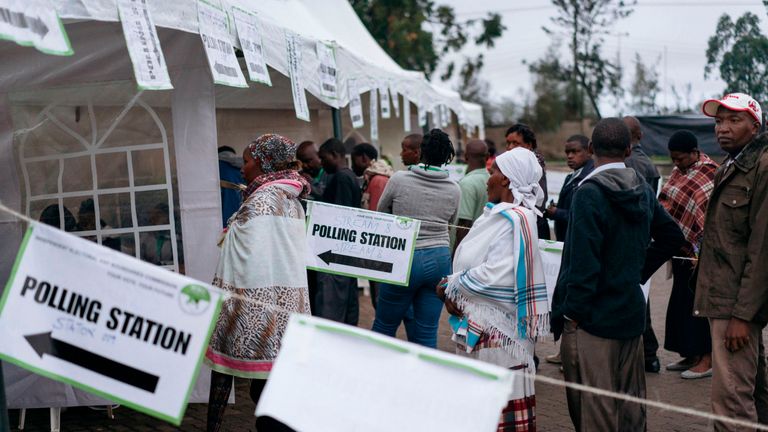 Voters queue to cast their ballots at a primary school in Mathare, Nairobi