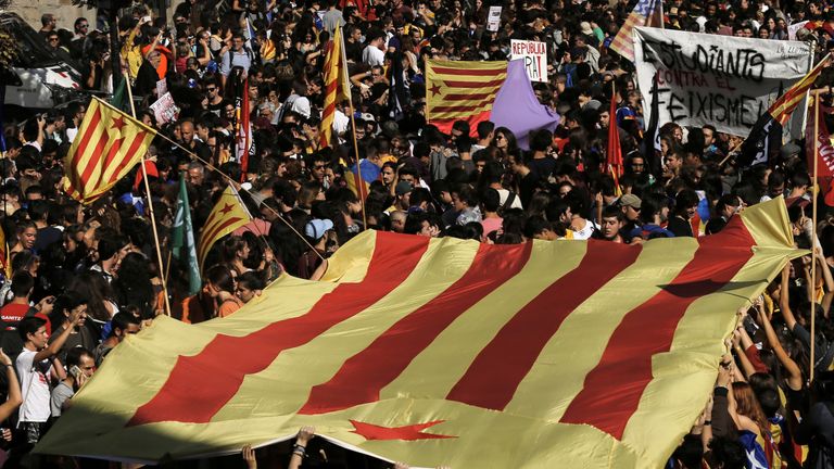 Students carry a pro-independence &#39;Estelada&#39; flag in Barcelona