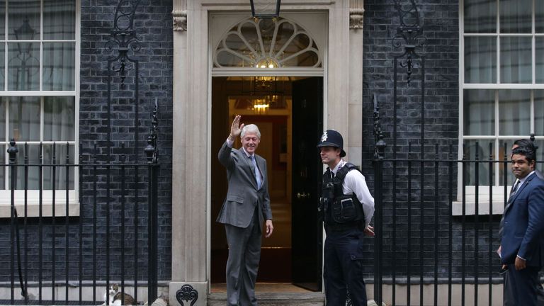 Former US President Bill Clinton waves as he arrives for a meeting with British Prime Minister Theresa May at Downing street in London on October 19, 2017. / AFP PHOTO / Daniel LEAL-OLIVAS (Photo credit should read DANIEL LEAL-OLIVAS/AFP/Getty Images)
