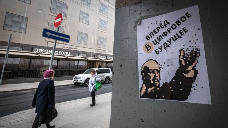 A poster in Moscow depicts communist leader Lenin as a champion of Bitcoin