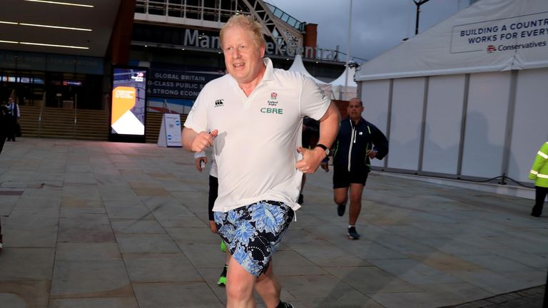 Foreign Secretary Boris Johnson returns to his hotel after an early morning run during the Conservative Party Conference in Manchester