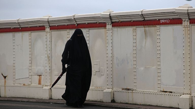 BIRMINGHAM, UNITED KINGDOM - JANUARY 27: A muslim woman wearing a traditional burqa walks through the streets of Birmingham&#39;s Spark Hill area on January 27, 2010 in Birmingham, United Kingdom. As the UK gears up for one of the most hotly contested general elections in recent history it is expected that that the economy, immigration, the NHS and education are likely to form the basis of many of the debates. (Photo by Christopher Furlong/Getty Images)
