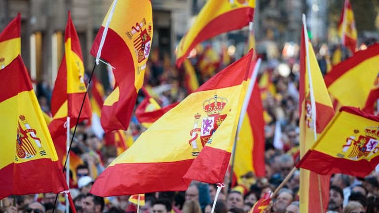 BARCELONA, SPAIN - OCTOBER 29: Protesters wave Spanish flags during a pro-unity demonstration on October 29, 2017 in Barcelona, Spain. Thousands of pro-unity protesters gather in Barcelona, two days after the Catalan Parliament voted to split from Spain. The Spanish government has responded by imposing direct rule and dissolving the Catalan parliament. (Photo by Jack Taylor/Getty Images)