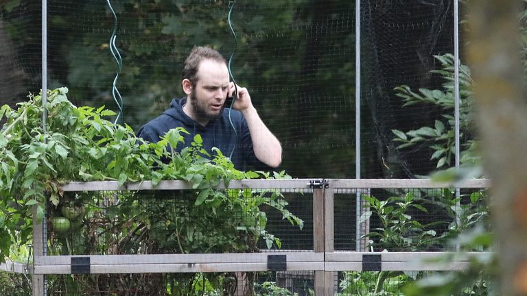 Freed Canadian hostage Joshua Boyle talks on the phone outside his family home