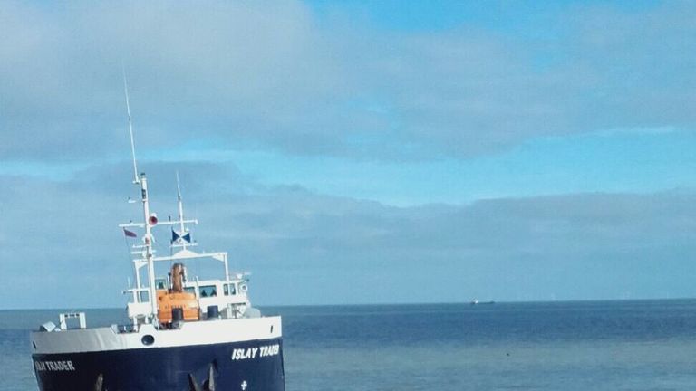 The Islay Trader aground beside a Gormley statue. Pic: Elizabeth Stone