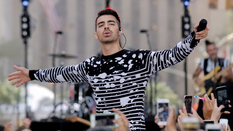 Joe Jonas performing with his band DNCE