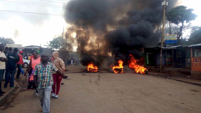 Tyres burn on the streets in Kibera, Nairobi, Kenya October 25, 2017 in this picture obtained from social media. FACEBOOK: STEVE KYENZE via REUTERS THIS IMAGE HAS BEEN SUPPLIED BY A THIRD PARTY. MANDATORY CREDIT. NO RESALES. NO ARCHIVES. MUST ON SCREEN COURTESY FACEBOOK: STEVE KYENZE/NO RESALE