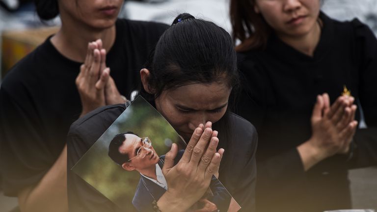 A woman mourns during the funeral procession for King Bhumibol