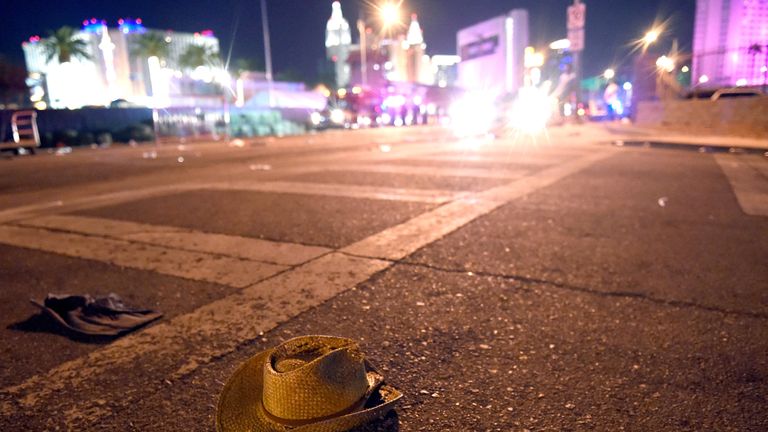 A cowboy hat lays in the street after shots were fired near a country music festival 