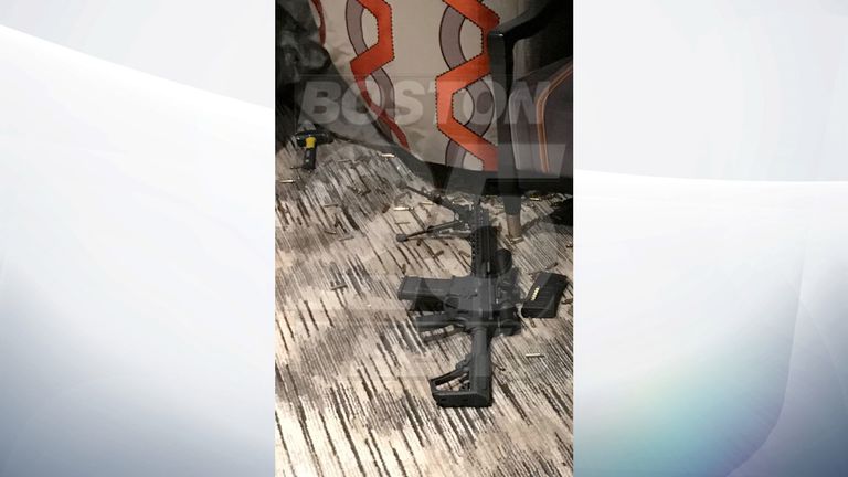 One of the semi-automatic weapons with bullet casings covering the floor. Pic: Fox25Boston