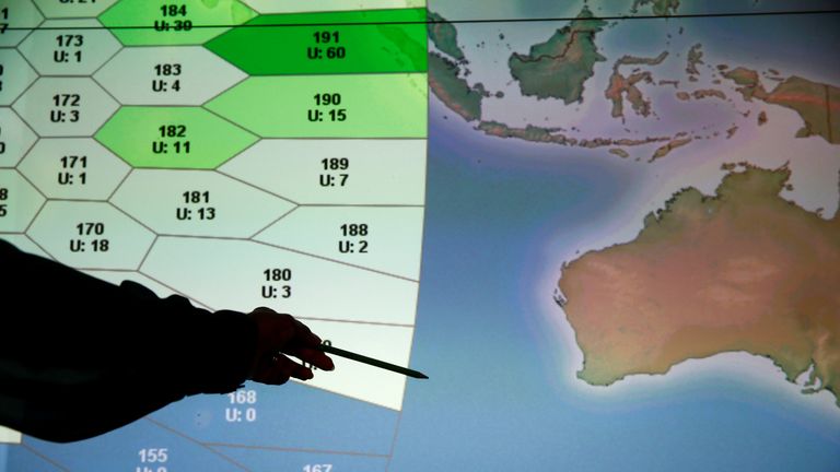 A member of staff at Inmarsat in front of a screen showing the southern Indian Ocean to the west of Australia