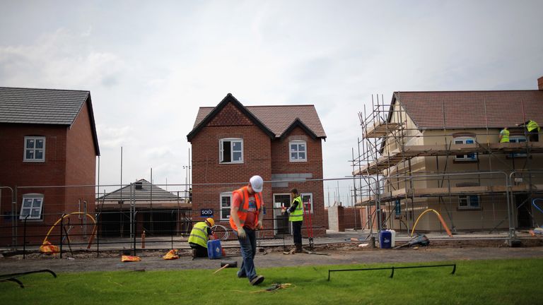 MIDDLEWICH, ENGLAND - MAY 20:  Construction workers build new houses on a housing development on May 20, 2014 in Middlewich, England. Official figures have shown that house prices have risen by 8% in the year ending in March. There have been calls by some experts for the UK Help to Buy scheme to scaled down as it boosts the property market.  (Photo by Christopher Furlong/Getty Images)