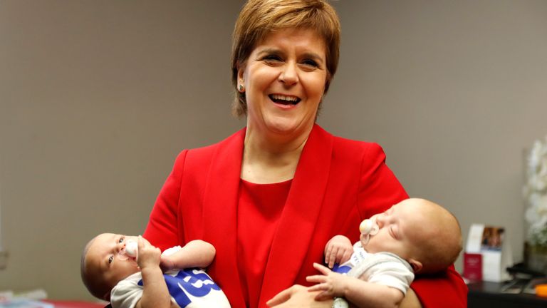 Scotland&#39;s First Minister Nicola Sturgeon, holds two babies during a visit to the conference creche at the Scottish National Party (SNP) conference in Glasgow, Scotland, October 9, 2017