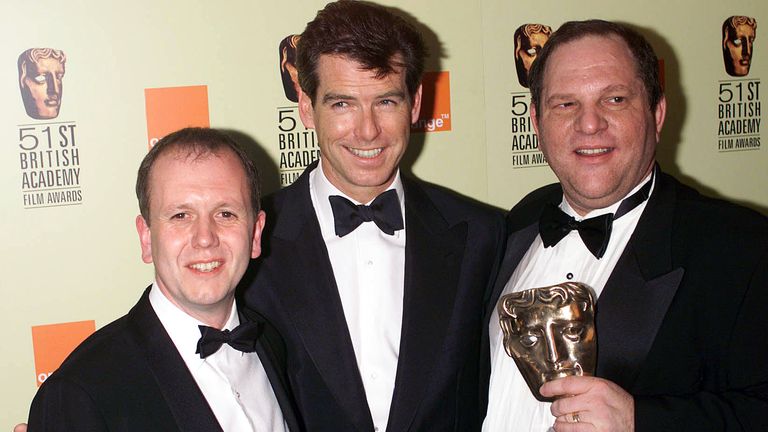 Harvey Weinstein, pictured here with David Parfitt and Pierce Brosnan (who presented the award) with his BAFTA award for Shakespeare in Love