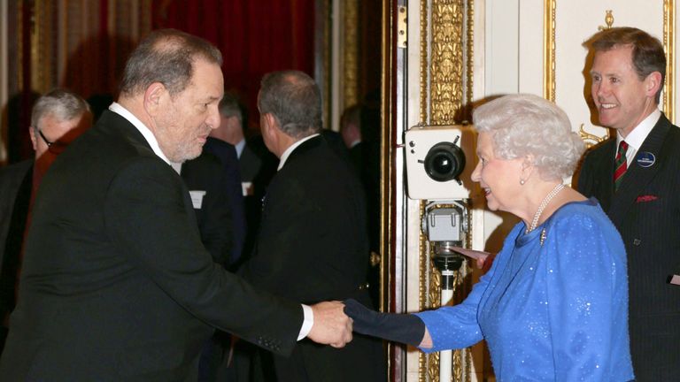 Queen Elizabeth II meets Harvey Weinstein during the Dramatic Arts reception at Buckingham Palace on February 17, 2014