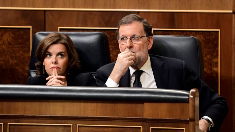 Prime Minister Mariano Rajoy (R) talks with Spanish Vice Prime Minister Soraya Saenz de Santamaria at the Congress of Deputies in Madrid on June 13