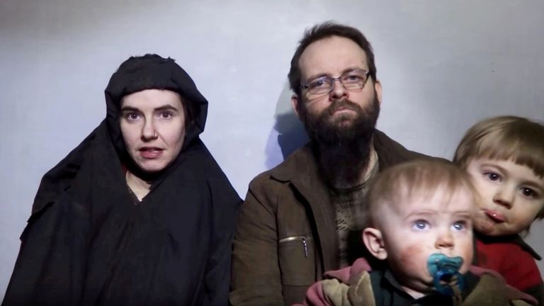 A still image from a video posted by the Taliban on social media on December 19, 2016 shows American Caitlan Coleman speaking next to her Canadian husband Joshua Boyle and their two sons