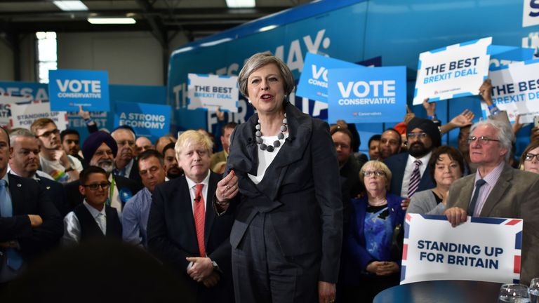 Prime Minister Theresa May is accompanied by Foreign Secretary Boris Johnson as she addresses supporters at a campaign event on June 6, 2017 in Slough, England