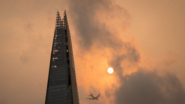 The Shard in central London, as the sky takes on an unusual orange colour caused by Storm Ophelia