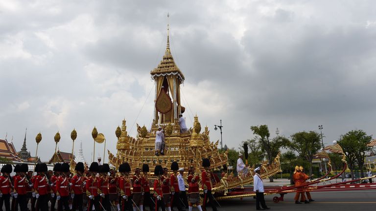 The royal urn is carried in the royal chariot through Bangkok