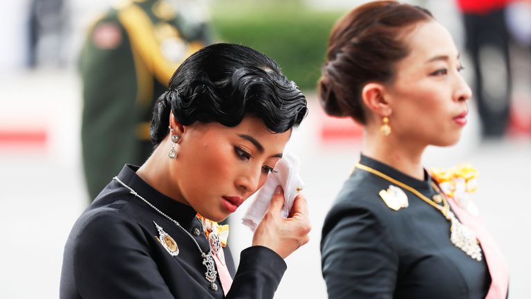 Thailand's Princesses Sirivannavari Nariratana and Bajrakitiyabha mourn at the funeral