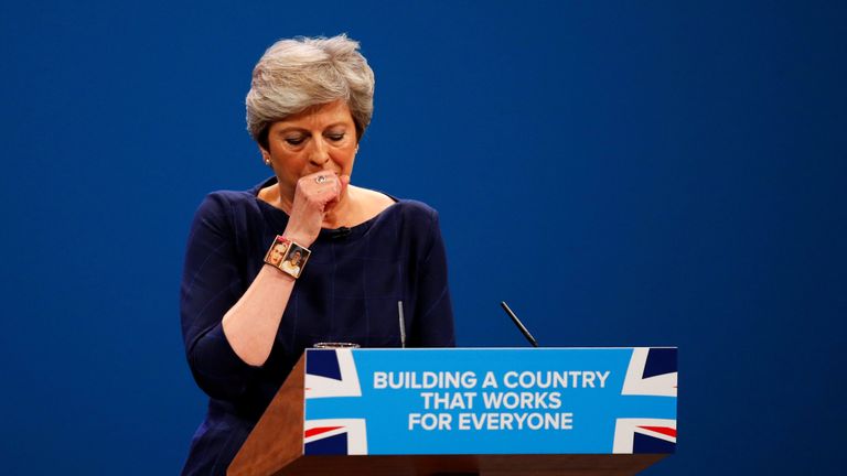 Britain&#39;s Prime Minister Theresa May coughs as she addresses the Conservative Party conference in Manchester