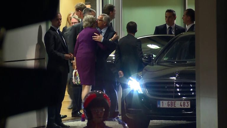 Theresa May and Jean-Claude Juncker embrace following talks in Brussels
