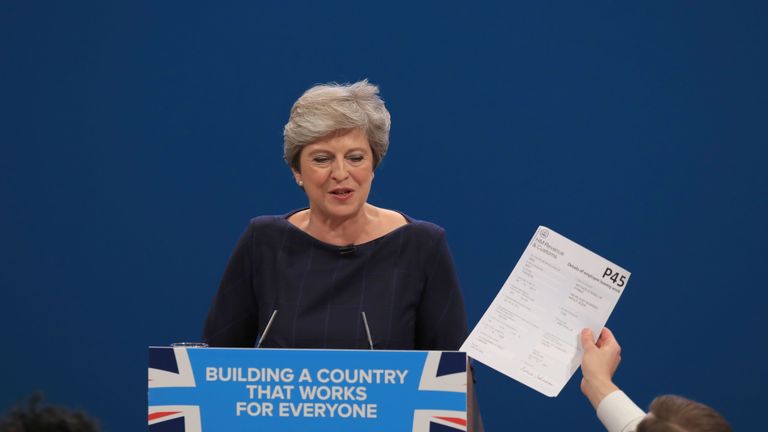 Comedian Simon Brodkin confronts Theresa May during her keynote speech at the Conservative Party Conference