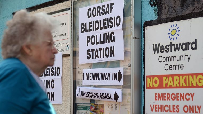 A woman arrives to cast her vote at the polling station in Westward Community Centre, Bridgend.
