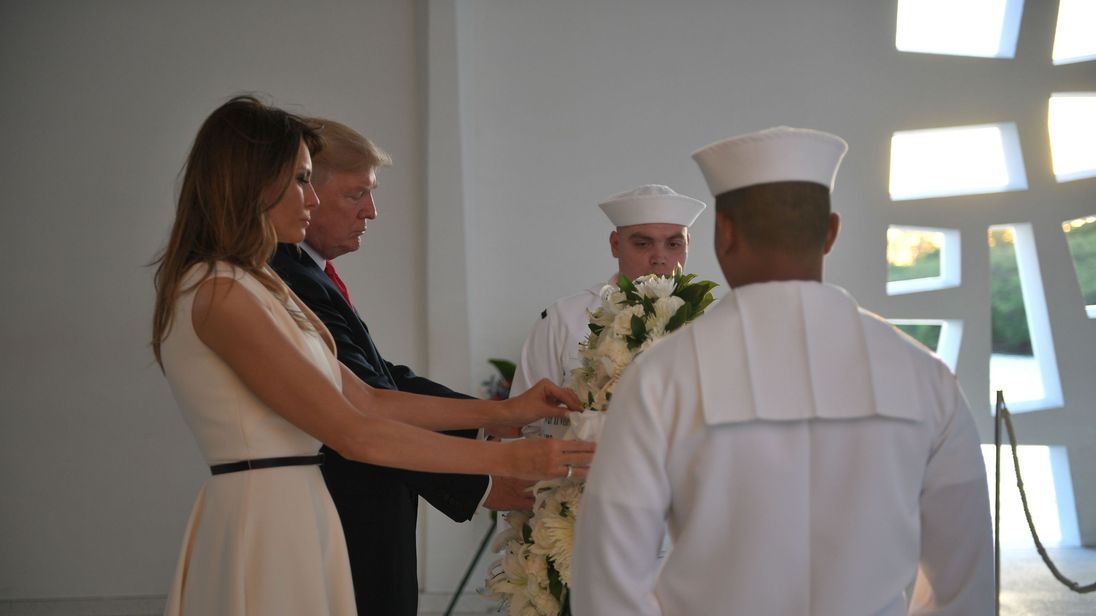 US President Donald Trump and First Lady Melania Trump lay a wreath at the USS Arizona Memorial on November 3, 2017, at Pearl Harbor in Honolulu, Hawaii