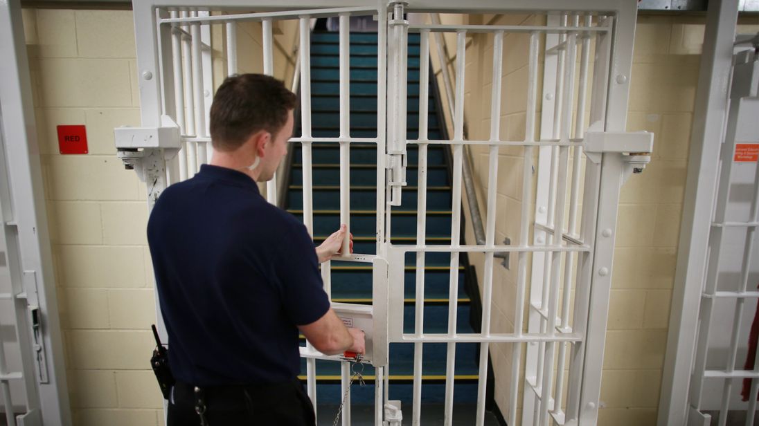 File photo dated 17/01/14 of a door being closed by a prison guard
