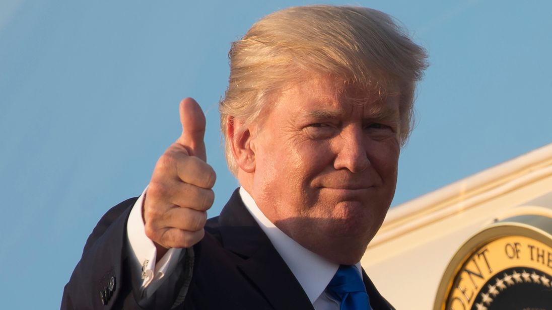 US President Donald Trump gives a thumbs-up as he boards Air Force One prior to departure from Andrews Air Force Base in Maryland, July 12, 2017, as they travel to Paris, France for Bastille Day