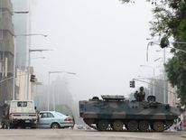 Military vehicles and soldiers patrol the streets in Harare, Zimbabwe