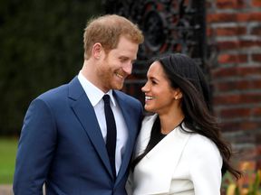 Prince Harry poses with Meghan Markle