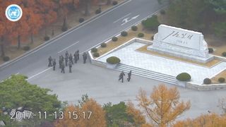 North Korean soldiers hold rifles and gather in the North Korean side of the Joint Security Area at the Demilitarized Zone