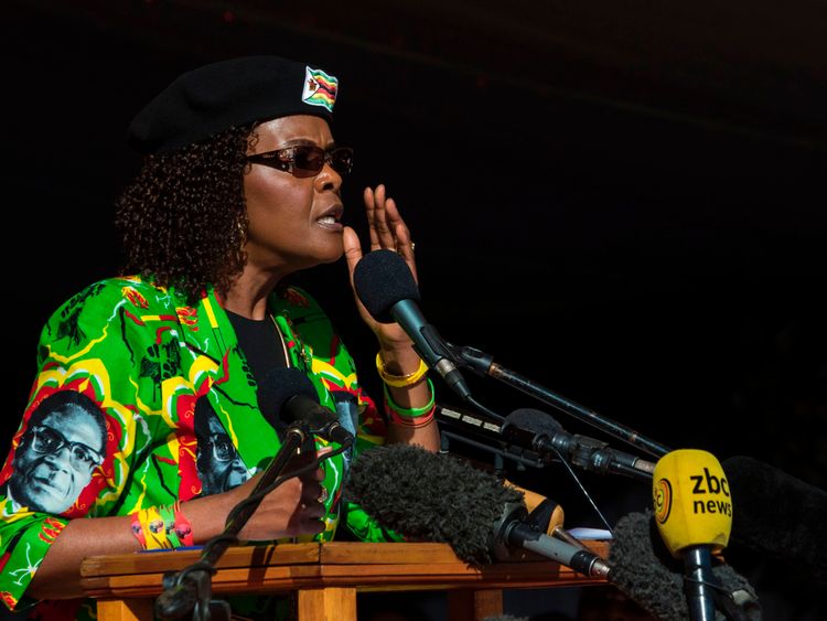 Mrs Mugabe wears a shirt bearing her husband's face at a ZANU-PF youth rally