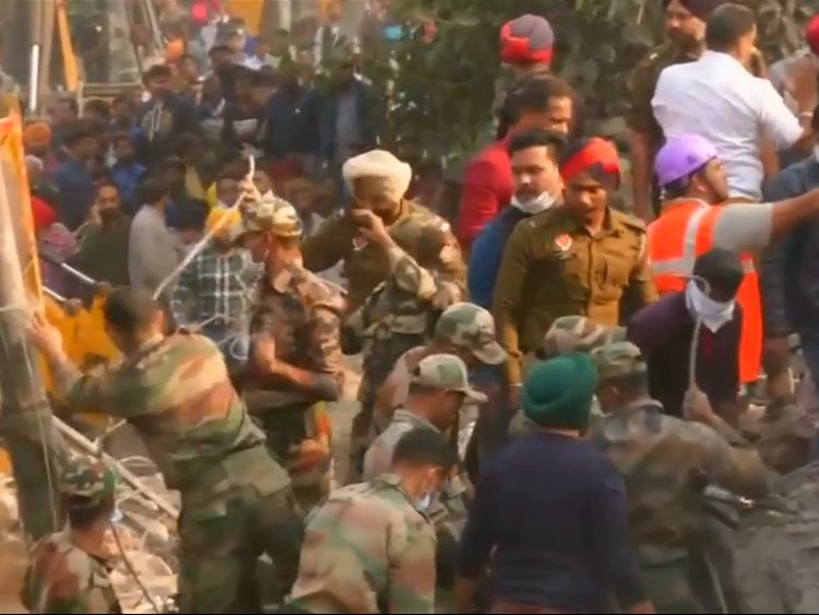 Residents looked on as rescue workers tried to find survivors and bodies
