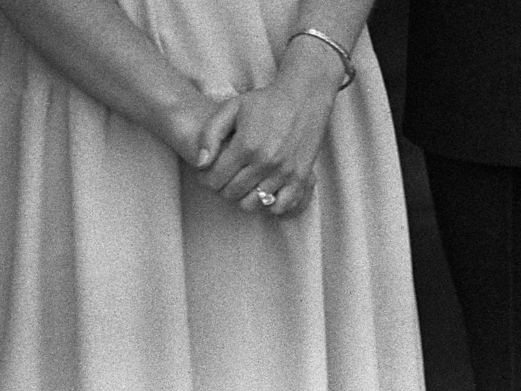 The Queen, then Princess Elizabeth, shows off her engagement ring at Buckingham Palace in July 1947