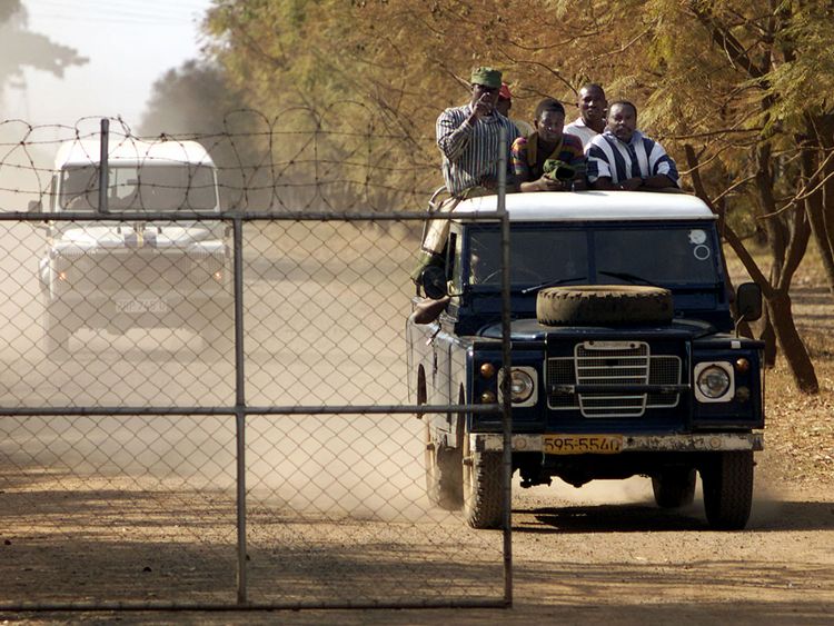 War veterans arrive to seize control of Parklands Farm, west of Harare, in 2000