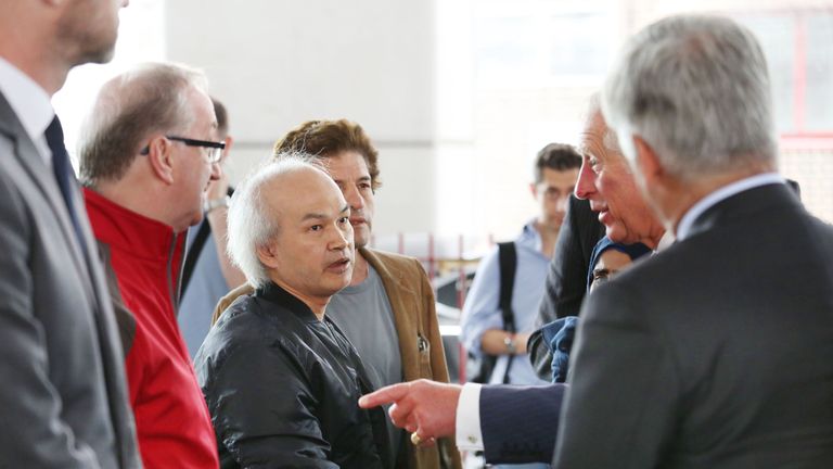 Anh Nhu Nguyen (left) met Prince Charles after the fire