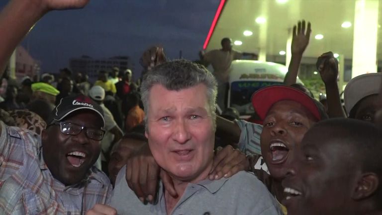 Sky&#39;s senior correspondent David Bowden mobbed by ecstatic crowds in Harare.