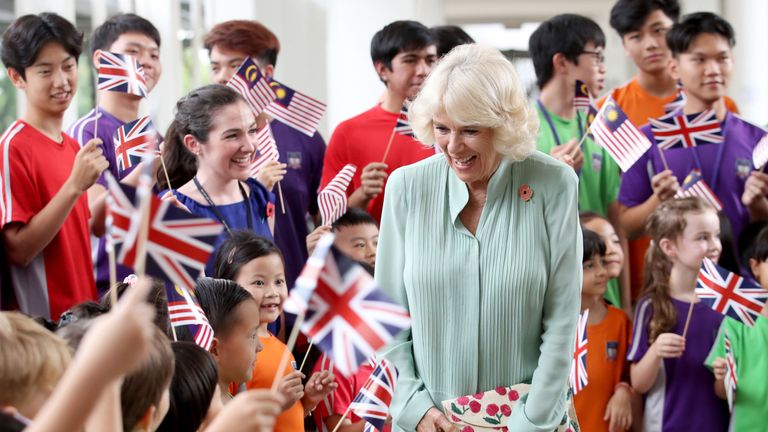 Students waved British and Malaysia flags at the school