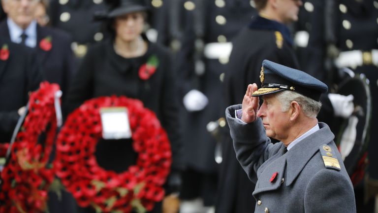 Prince Charles salutes in front of the Cenotaph