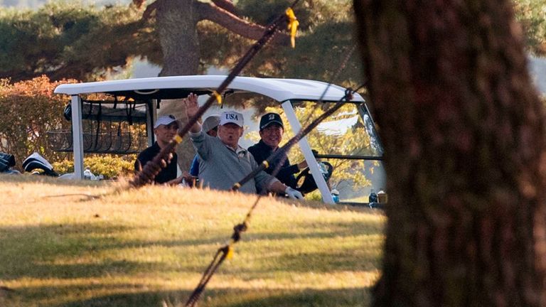 Donald Trump and Shinzo Abe in a golf cart after a round at the Kasumigaseki club in Kawagoe