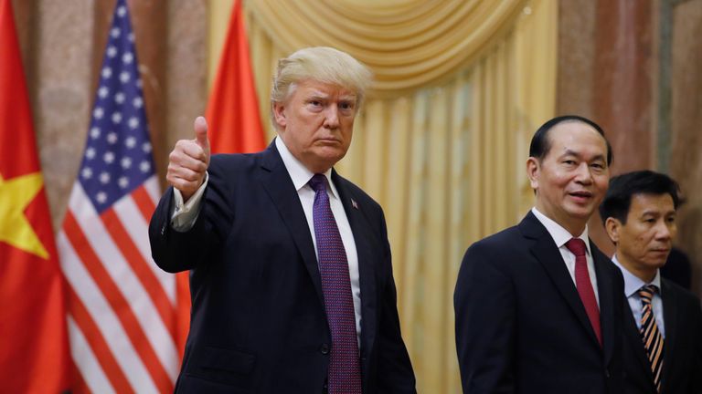 Donald Trump gives a thumbs up next to Vietnam&#39;s President Tran Dai Quang