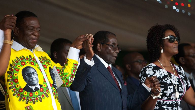 Mr Mnangagwa with Mr Mugabe (centre) and his wife Grace in 2016