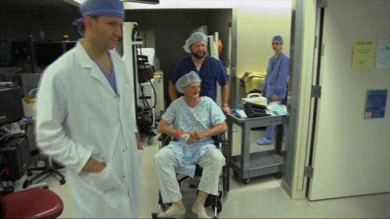 Andy Sandness is wheeled into surgery for his transplant