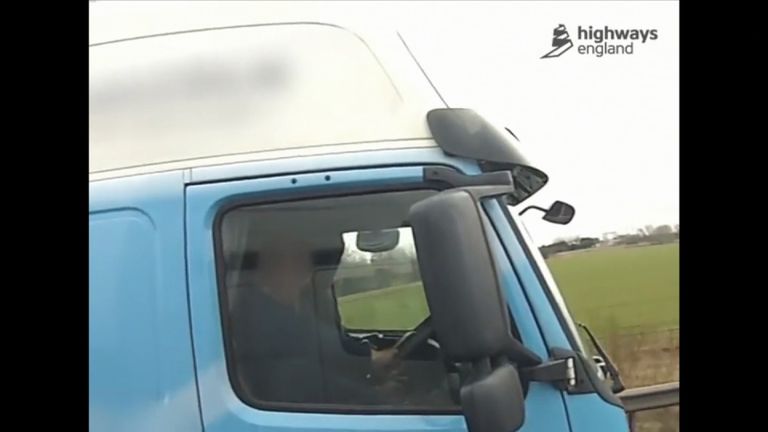 Man filmed driving truck with his left foot on dash