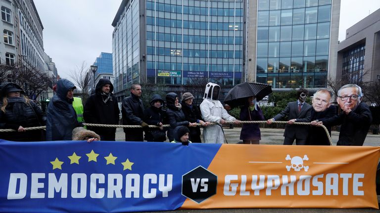 Some protestors wore masks depicting EU Commissioner for Health and Food Safety Vytenis Andriukaitis European Commission President Jean Claude Juncker