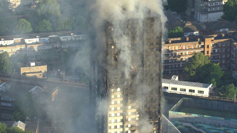 The smoking ruin of Grenfell Tower following the fire which killed71